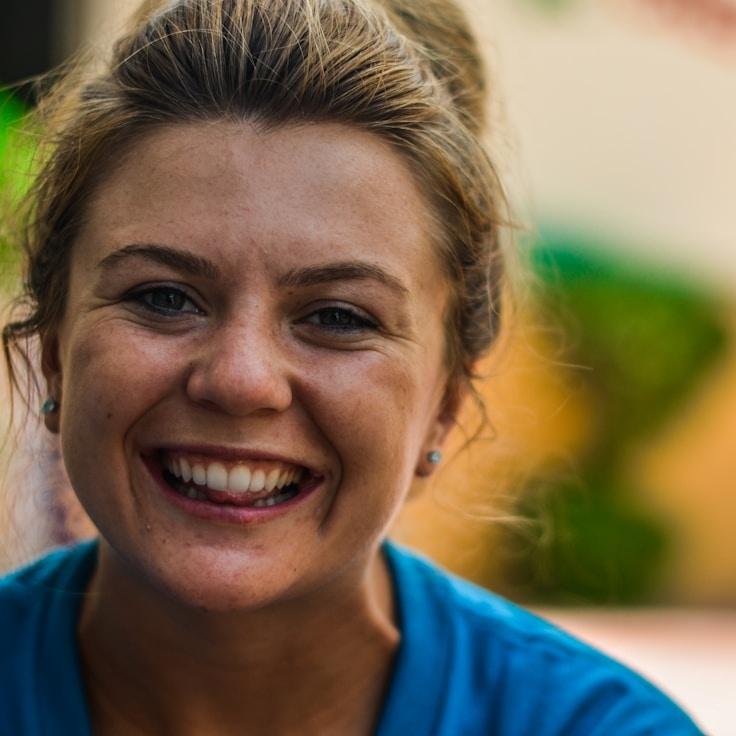 Kaveri Mehta, Lead Design Curator at Archive Volume Ledger, reviewing corporate floral arrangements